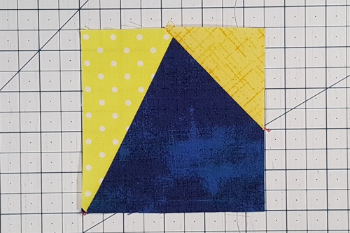 Step 3d Galaxy Star Quilt Block Variation Pattern: Press the small triangle right side up, pressing the seam towards it. Step 3d Galaxy Star Quilt Block Variation Pattern: Press the small triangle right side up, pressing the seam towards it.