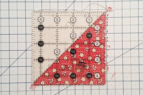 Step 2a half square triangle quilt pattern: Trim half square triangles. Step 2a half square triangle quilt pattern: Trim half square triangles.