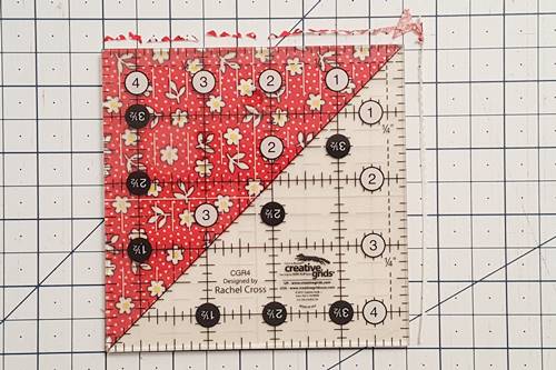 Step 2b half square triangle quilt pattern: Finish trimming half square triangles. Step 2b half square triangle quilt pattern: Finish trimming half square triangles.