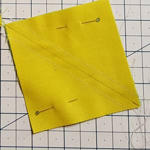 Half square triangle with seams