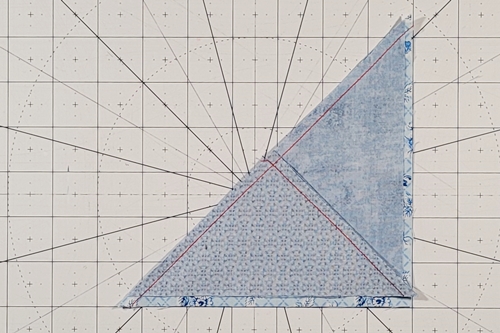 Hope of Hartford Quilt Block Step 5: 
Using the fold as a guide, center a QST unit over each HST. Stitch a seam along the diagonal length.