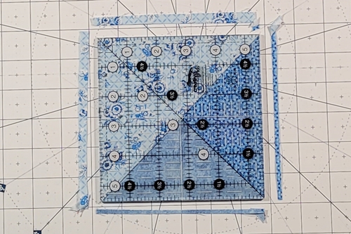 Hope of Hartford Quilt Block Step 6: 
Peel the QST unit back and right side up to reveal the star points. Trim to size according to the cutting and trimming chart near the top of the page.