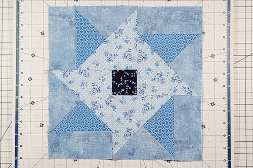 Hope of Hartford Quilt Block Step 14: 
Fold the bottom portion of the block right side up to reveal a complete Hope of
Hartford quilt block!  Press the seam toward the center square.