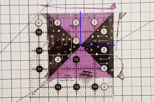 Step 6 Hourglass Quilt Block: How To Square Up Hourglass Blocks. Step 6 Hourglass Quilt Block: How To Square Up Hourglass Blocks - Use a rotary cutter to trim the unit along the right and top edges.