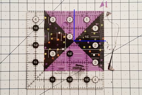 Step 7 Hourglass Quilt Block: Trim the unit along the right and top edges. Step 7 Hourglass Quilt Block: Use a rotary cutter to trim the unit along the right and top edges.