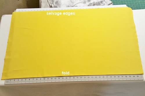 Yard of fabric on cutting mat. Step 1 Press.