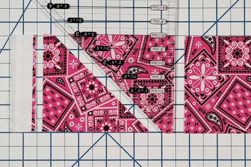 How to Make Flying Geese Step 5: make a cut along the straight side of the ruler.
You now have two more have square triangle units.