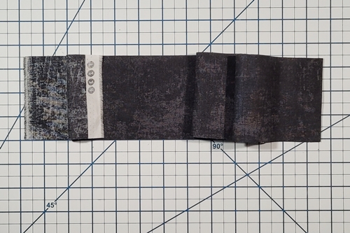 How to Make Flying Geese Step 7: fold fabric strip in half, right sides together.