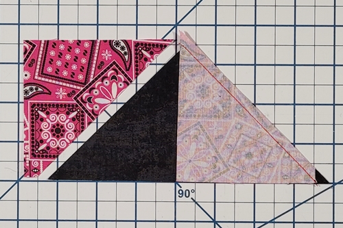 How to Make Flying Geese Step 12: Place right HST right side down on top of QST, aligning the bottom and angled edges of both. Blunt tip of HST aligns about a 1/4 inch in from tip of QST. Stitch.