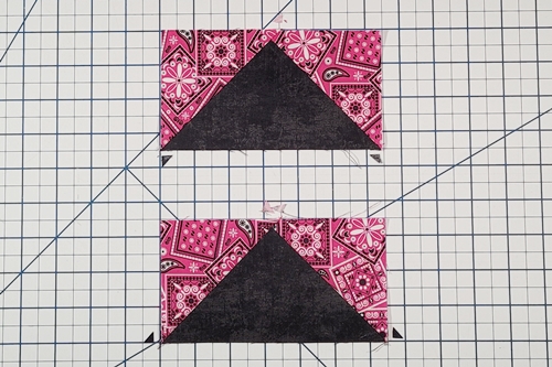 How to Make Flying Geese Step 16: trim the dog ears from the flying geese units.