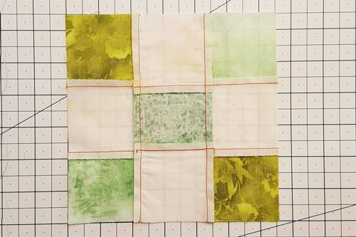 Step 5 Irish Chain Quilt Block: Press the seams outwards, away from the center unit.
