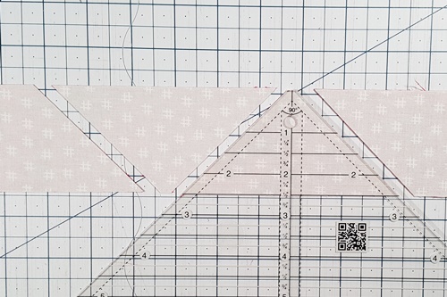 Step 1 Ohio Star Quilt Block Pattern: Use a quarter square triangle (QST) ruler to cut 8 quarter square triangles. Step 1 Ohio Star Quilt Block Pattern: Use a quarter square triangle (QST) ruler to cut 8 quarter square triangles.