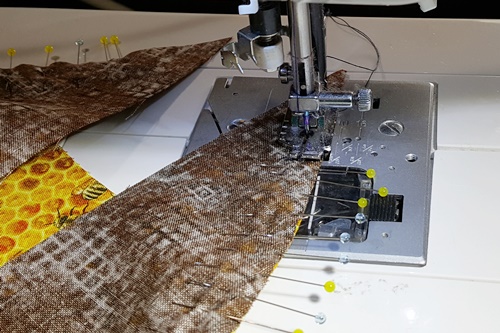 Step 14 Orange Peel Quilt Block: With the half melon on top stitch a 1/4 inch seam. Remove the pins as the needle gets to it. Try not to stitch over the pin. Step 14 Orange Peel Quilt Block: With the half melon on top stitch a 1/4 inch seam. Remove the pins as the needle gets to it. Try not to stitch over the pin.