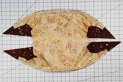 Step 16 Orange Peel Quilt Block: From the wrong side of the fabric here's how the background piece and first two half melons look after stitching. Step 16 Orange Peel Quilt Block: From the wrong side of the fabric here's how the background piece and first two half melons look after stitching.