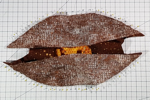 Step 18 Orange Peel Quilt Block: Repeat Step 12 to pin the right and left half melons to the background. Repeat steps 14 and 15 to stitch. Step 18 Orange Peel Quilt Block: Repeat Step 12 to pin the right and left half melons to the background. Repeat steps 14 and 15 to stitch.