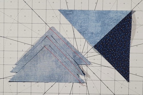 Quarter Square Triangle: In Photo 1, the left edges are stitched together. In Photo 2, the right edges are stitched together. Quarter Square Triangle: In Photo 1, the left edges are stitched together. In Photo 2, the right edges are stitched together.