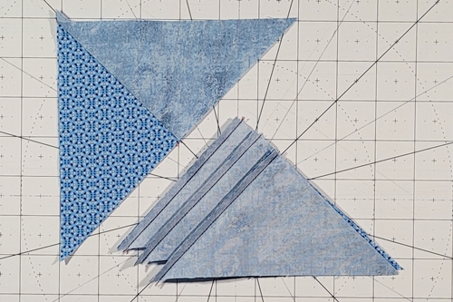 Quarter Square Triangle: In Photo 1, the left edges are stitched together. In Photo 2, the right edges are stitched together. Quarter Square Triangle: In Photo 1, the left edges are stitched together. In Photo 2, the right edges are stitched together.