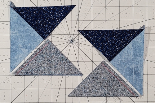 Quarter Square Triangle Tutorial: split quarter square triangles are sewn with background Fabric B on the bottom. Quarter Square Triangle Tutorial: split quarter square triangles are sewn with background Fabric B on the bottom.