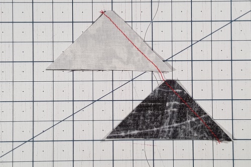 How To Use A Quarter Square Triangle Ruler: The fabric on top when the QST goes under the needle will be on top when the fabric is flipped right side up. How To Use A Quarter Square Triangle Ruler: The fabric on top when the QST goes under the needle will be on top when the fabric is flipped right side up.