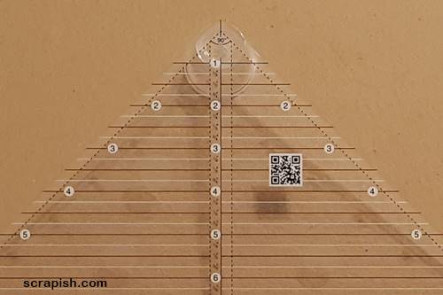 Picture of a closeup of a Creative Grids (R) quarter square triangle ruler