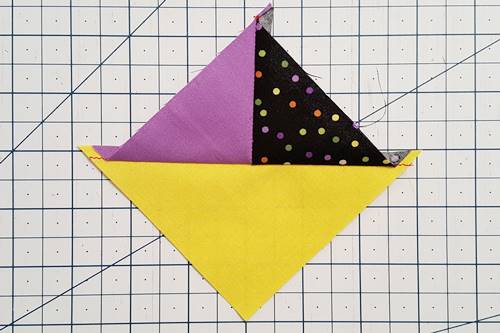 Step 5 quarter square triangles: Press the seams open or toward the darker fabric. Step 5 quarter square triangles: Press the seams open or toward the darker fabric.