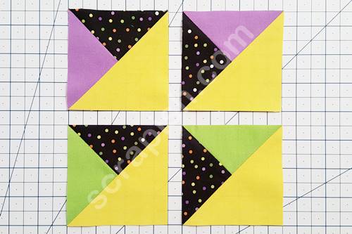 A picture of two sets of mirror image quarter square triangles.