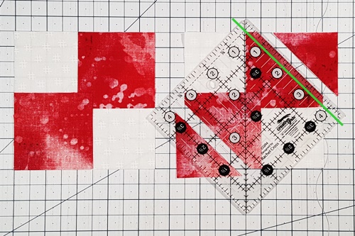 Step 1 Place small squares right sides together on large square. Step 2 Place 1/4 inch measurement line on diagonal center of small square. cut along ruler's edge, leaving 1/4 inch seam allowance. Step 1 Place small squares right sides together on large square. Step 2 Place 1/4 inch measurement line on diagonal center of small square. cut along ruler's edge, leaving 1/4 inch seam allowance.