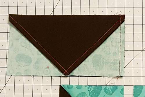 Step 3b Sew the units together using a 1/4 inch seam along the right side of the units for this star quilt block pattern.