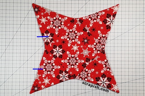 Step 8 Star Table Topper Quilt Pattern: turn the open edges under 1/4 inch, or even with sewn edges, and press. Step 8 Star Table Topper Quilt Pattern: turn the open edges under 1/4 inch, or even with sewn edges, and press.