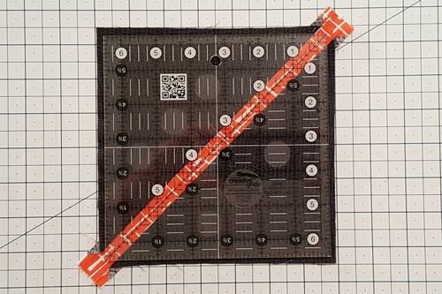 Step 12 Stem for Leaf Quilt Blocks:  To trim the stem patch unit place the diagonal 45 degree line of a quilting ruler down the middle of the stem. Step 12 Stem for Leaf Quilt Blocks:  To trim the stem patch unit place the diagonal 45 degree line of a quilting ruler down the middle of the stem.