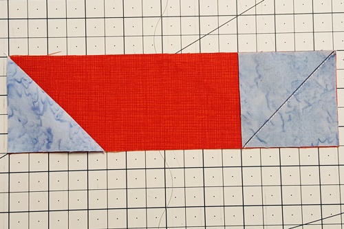 Step 4 stitch and flip: flip triangle down to test if stitched on square/triangle will replace fabric to be cut away. Step 4 stitch and flip: flip triangle down to test if stitched on square/triangle will replace fabric to be cut away.
