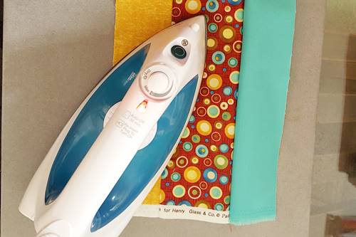 Step 3b Strip quilting: Open the strip set so that the right side of both fabrics face up. Press the seams towards the darker fabric. Step 3b Strip quilting: Open the strip set so that the right side of both fabrics face up. Press the seams towards the darker fabric.