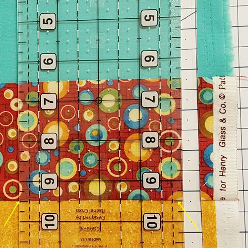 Step 4b Strip quilting: Here's a close-up of the quilting ruler placed on the lower seam line. Step 4b Strip quilting: Here's a close-up of the quilting ruler placed on the lower seam line.