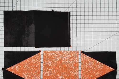 Step 6 Triangle in a Square Star: stitch  units of Row 1. Right sides together, align background square from Column 3 on top of triangle in a square unit. Stitch with a 1/4 inch seam allowance. Step 6 Triangle in a Square Star: stitch  units of Row 1. Right sides together, align background square from Column 3 on top of triangle in a square unit. Stitch with a 1/4 inch seam allowance.