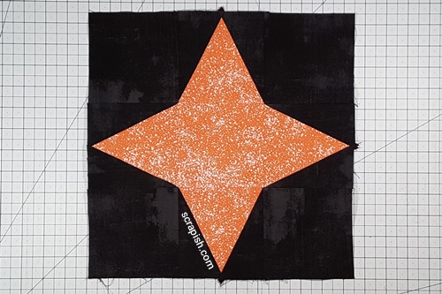 Step 11 Triangle in a Square Star: Flip Row 3 right side up. Press the seams between the rows open. Step 11 Triangle in a Square Star: Flip Row 3 right side up. Press the seams between the rows open.